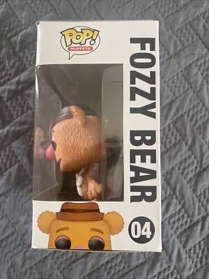 Side view of a Pop figurine in the box of Fozzie Bear. The box labels the contents as "Fozzy Bear."